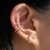 Sample Item: Classic Huggie Hoops in Rose Gold sold by Maison Miru