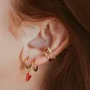 Sample Item: Classic Huggie Hoops in Rose Gold sold by Maison Miru