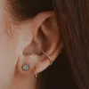 Sample Item: Classic Huggie Hoops in Rose Gold sold by Maison Miru