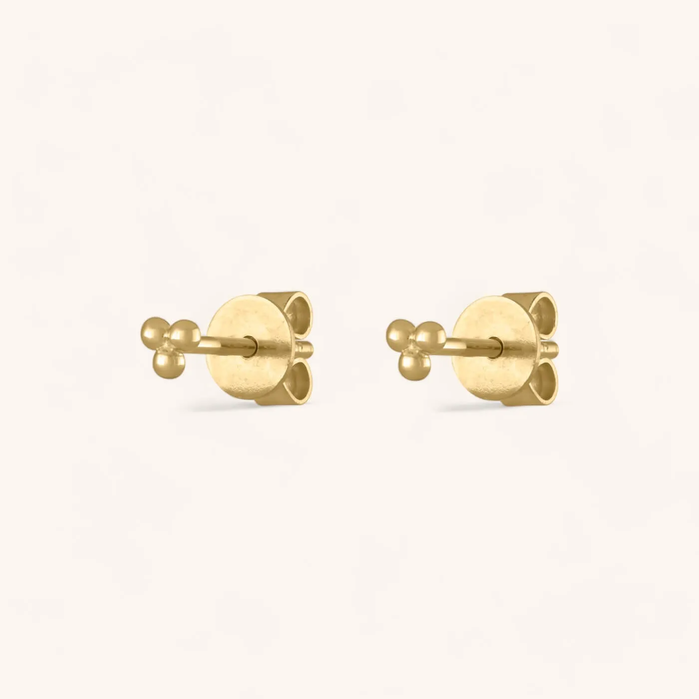 Tiny Trinity Studs in 14k Gold sold by Maison Miru
