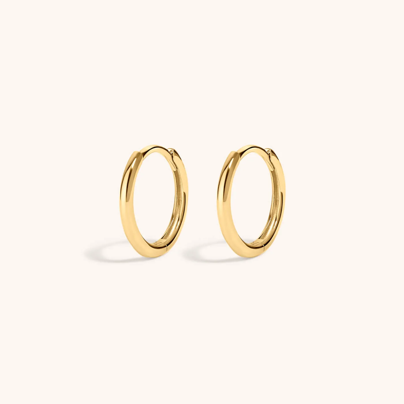 Classic Huggie Hoops in 14k Gold sold by Maison Miru