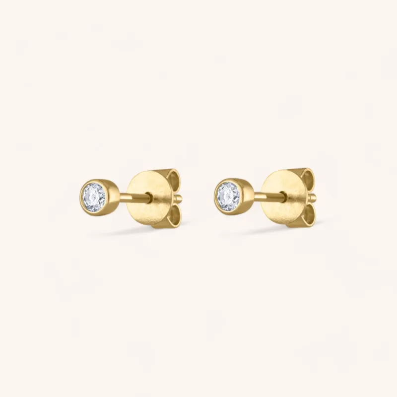 Tiny Diamond Studs in 14k Gold sold by Maison Miru
