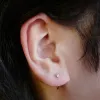 Dewdrop Huggie Earrings in Titanium sold by Maison Miru