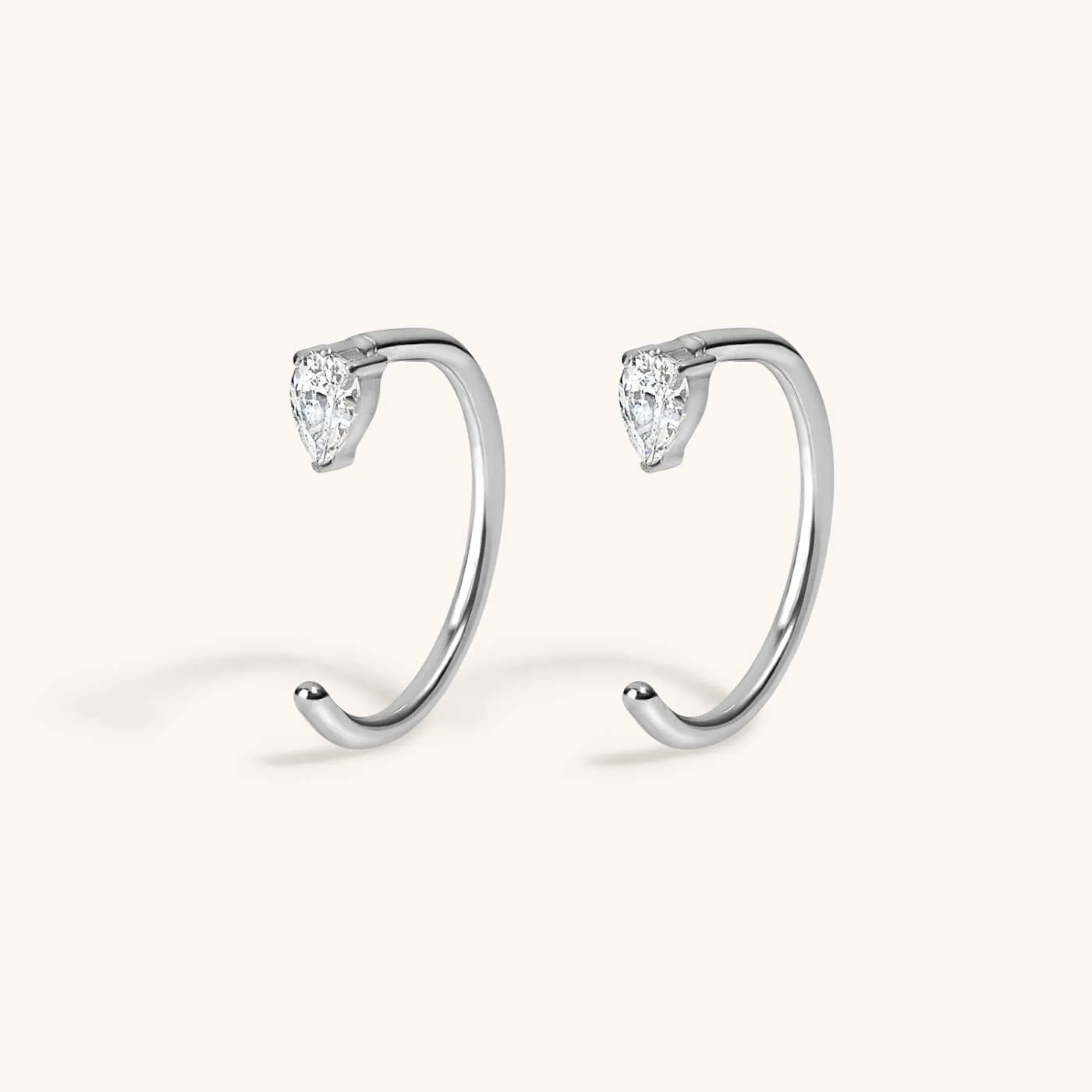 Sample Item: Dewdrop Huggie Earrings in Titanium sold by Maison Miru product image thumbnail 3