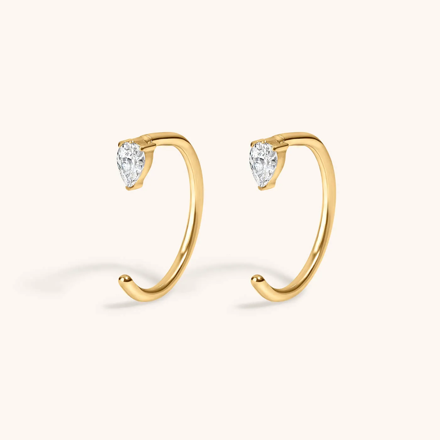 Pear Open Huggie Hoops sold by Maison Miru