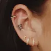 Eternity Cartilage Hoop in 14k Gold sold by Maison Miru