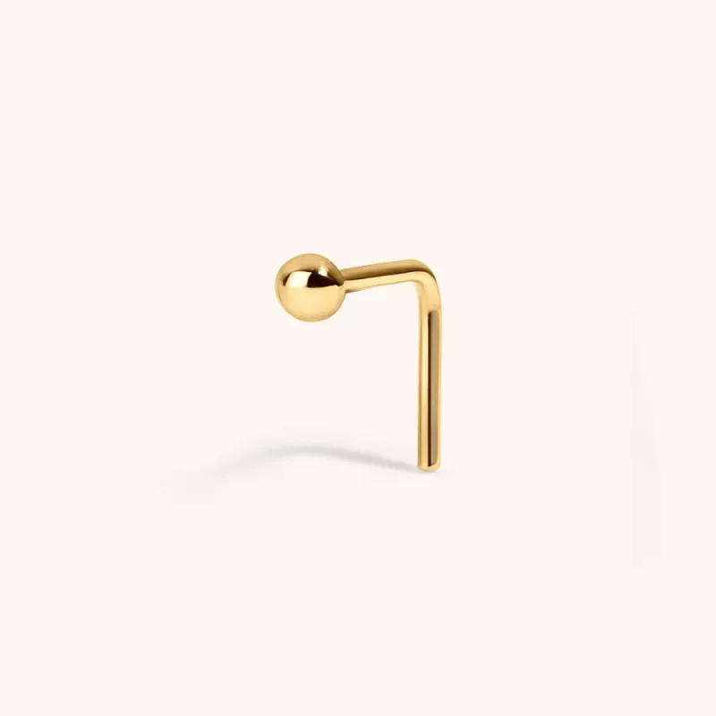 Tiny Secret Stud L-Shape Nose Ring in 14k Gold sold by Maison Miru