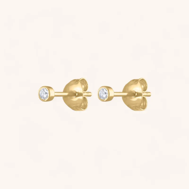 Tiny Sapphire Studs in 14k Gold sold by Maison Miru