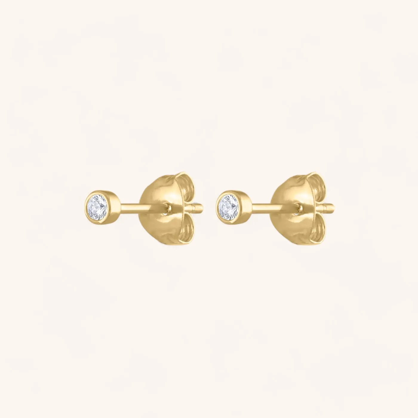 Tiny Sapphire Studs in 14k Gold sold by Maison Miru