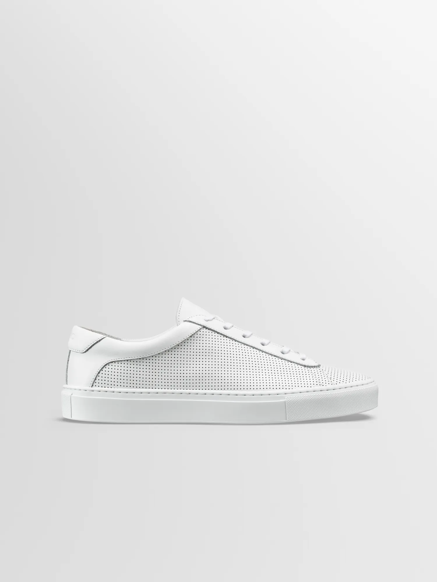 Capri in Triple White Perforated sold by Koio