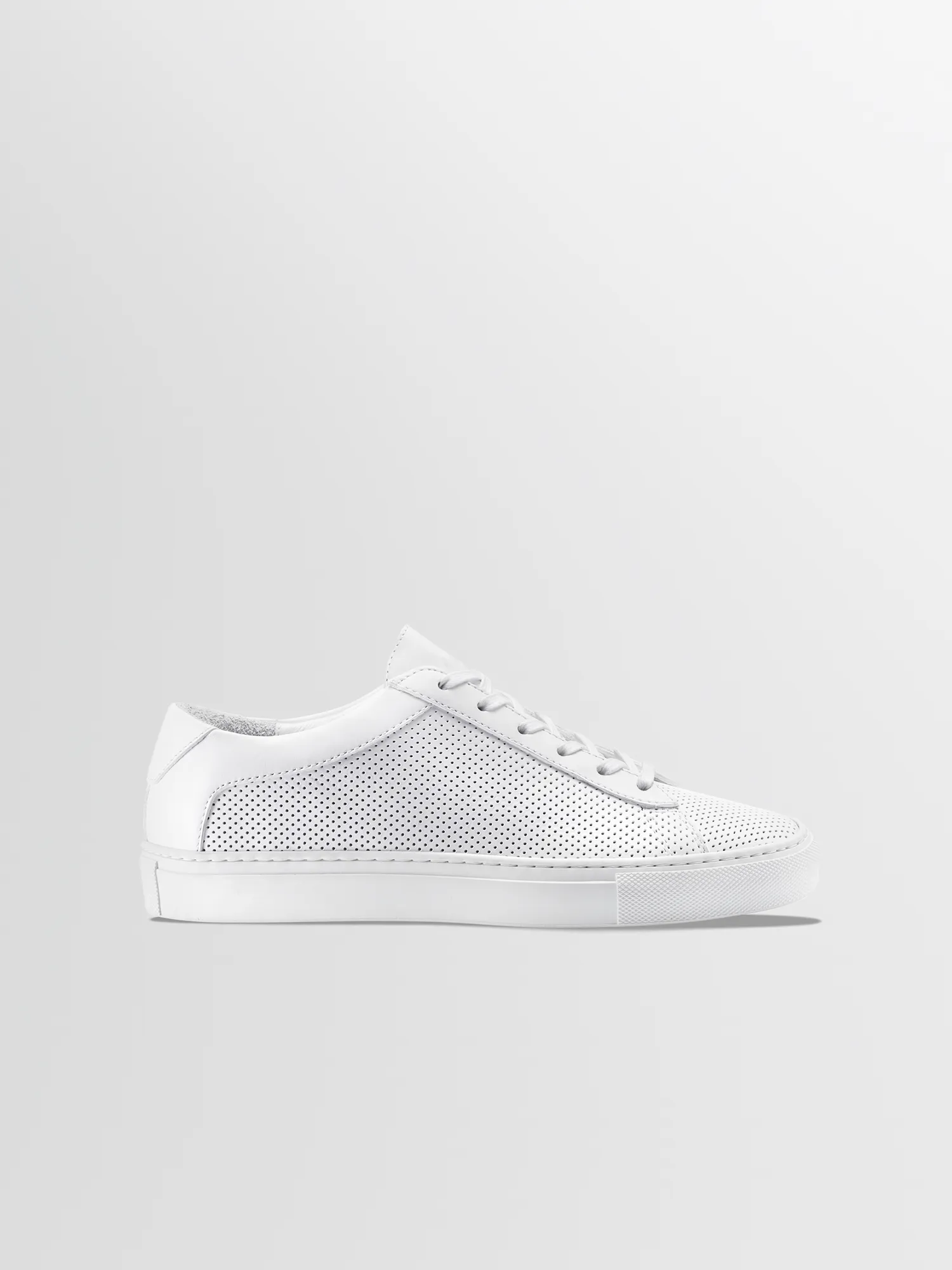 Capri in Triple White Perforated sold by Koio
