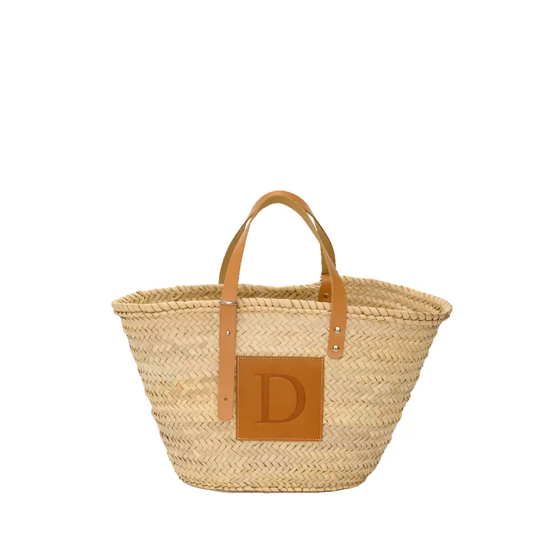 The Patchwork Straw Initial Shopper sold by Lily and Bean