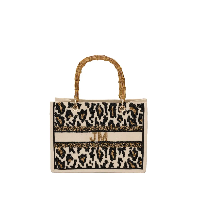 The Juliana Leopard Mini Teenie Beaded Tote sold by Lily and Bean