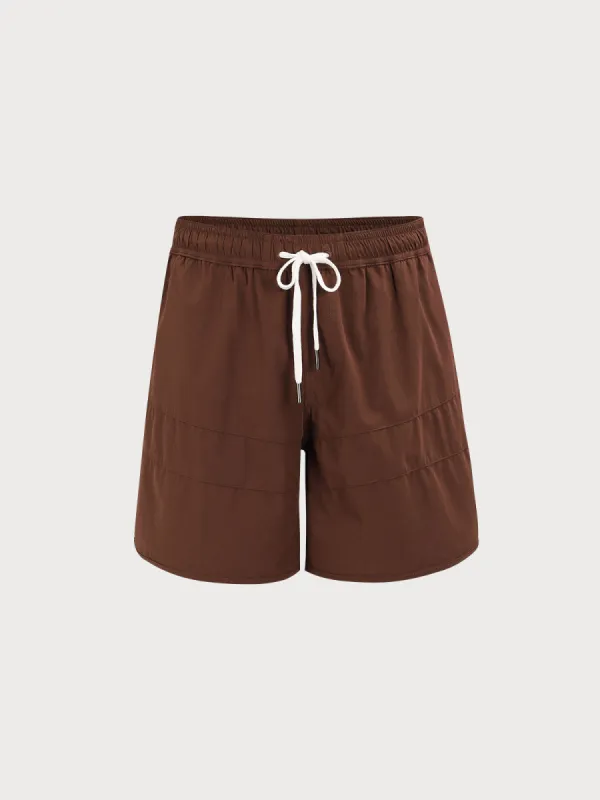 The Dark Coffee Beach Men's 7" Swimming Trunks sold by BERLOOK