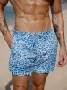 Hapnix® - The Blue Leopard Men's 5" Swim Trunks sold by BERLOOK