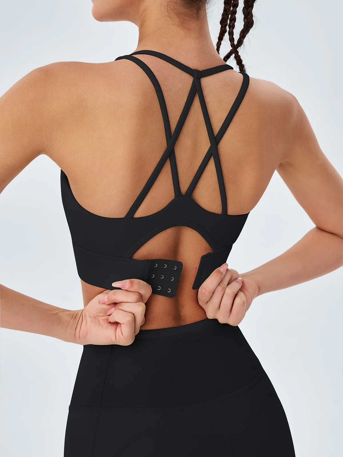Black X Cross Cut Out Sports Bra sold by BERLOOK