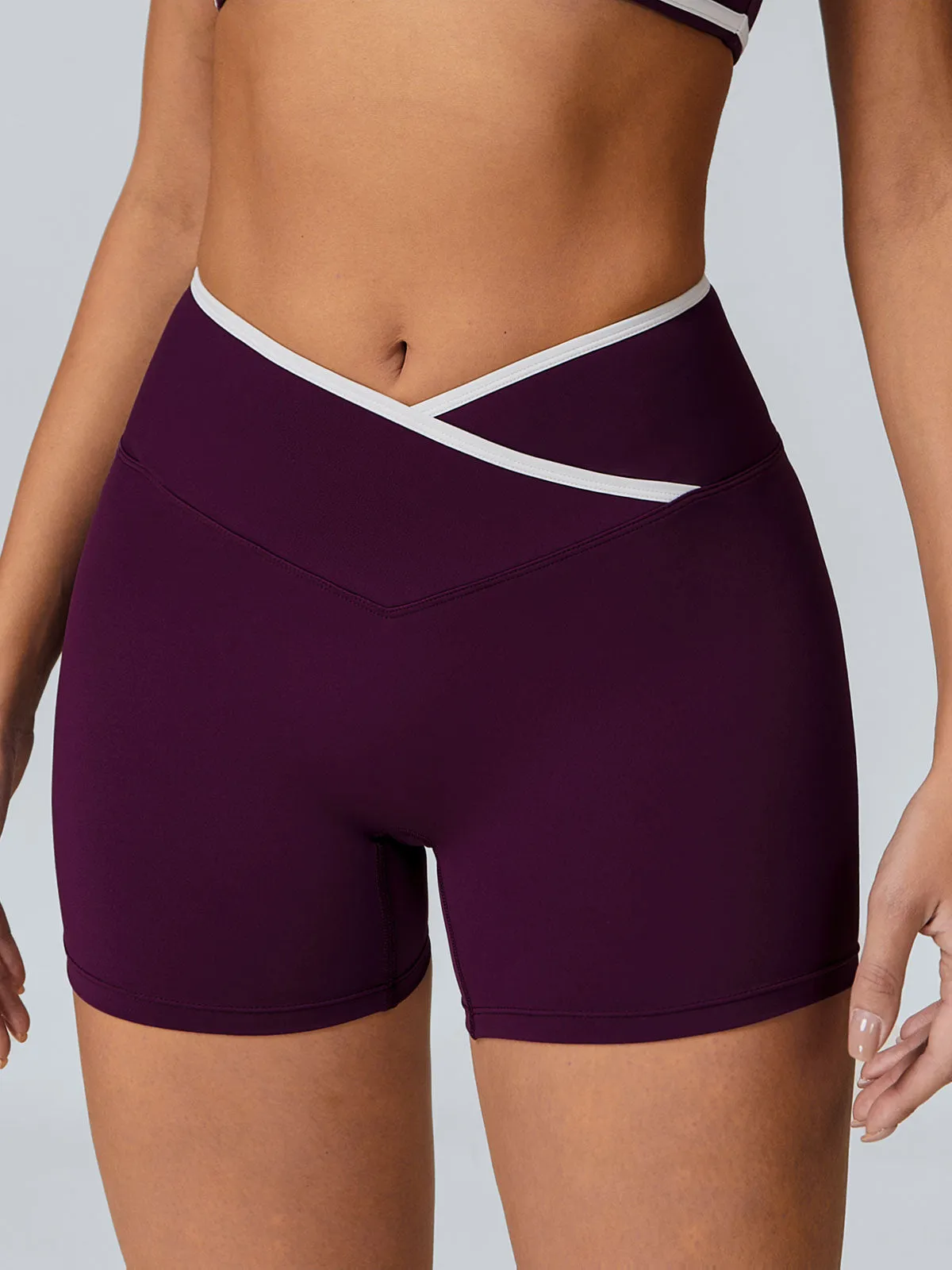 Purple Contrast Front-Cross Sports Shorts 3" sold by BERLOOK