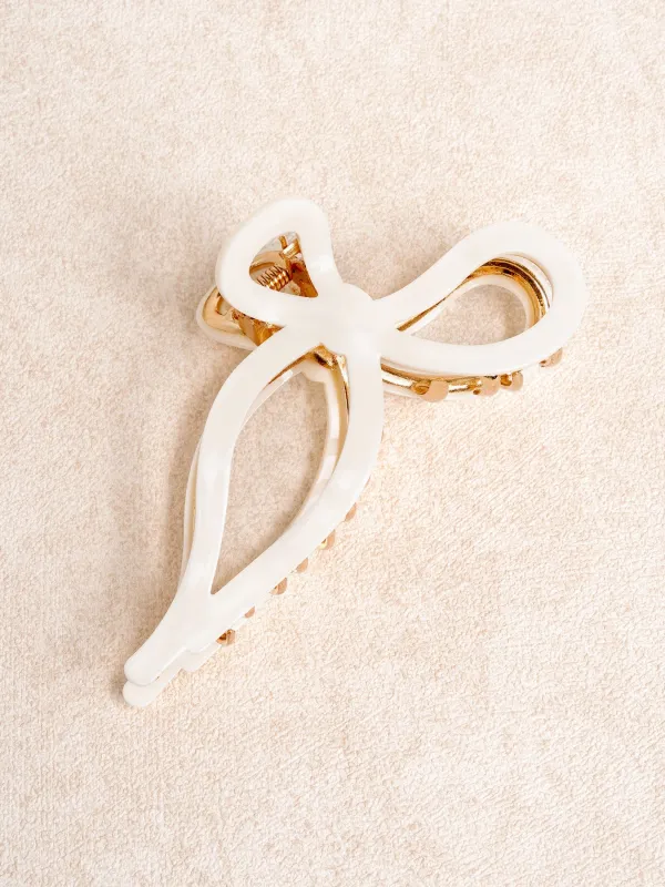 White Bow Plastic Hair Clip sold by BERLOOK