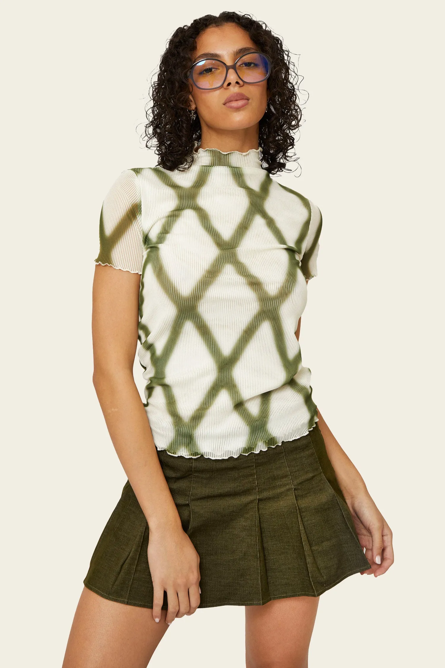 Rio Mesh Mockneck Tee sold by FIND ME NOW