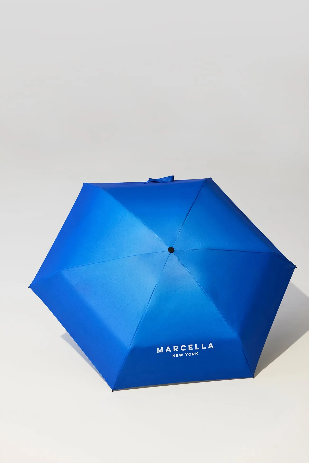 Branded Compact Umbrella sold by Marcella NYC product image thumbnail 3