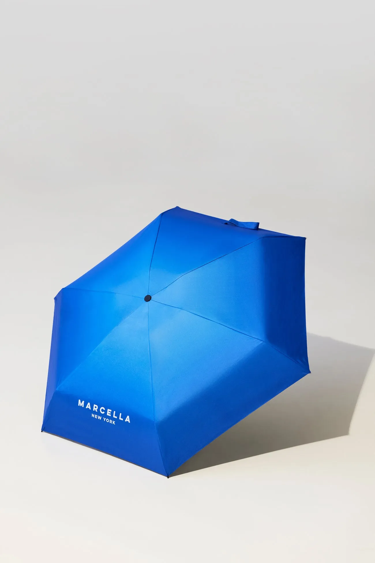 Branded Compact Umbrella sold by Marcella NYC product image thumbnail 5