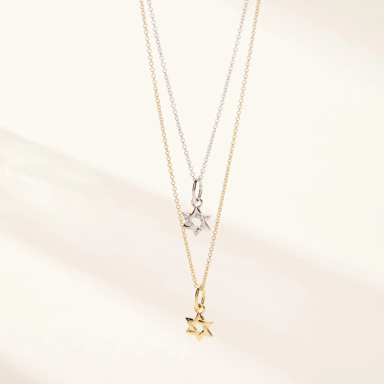 14k Gold Pavé Diamond Star of David Charm sold by Tiny Tags