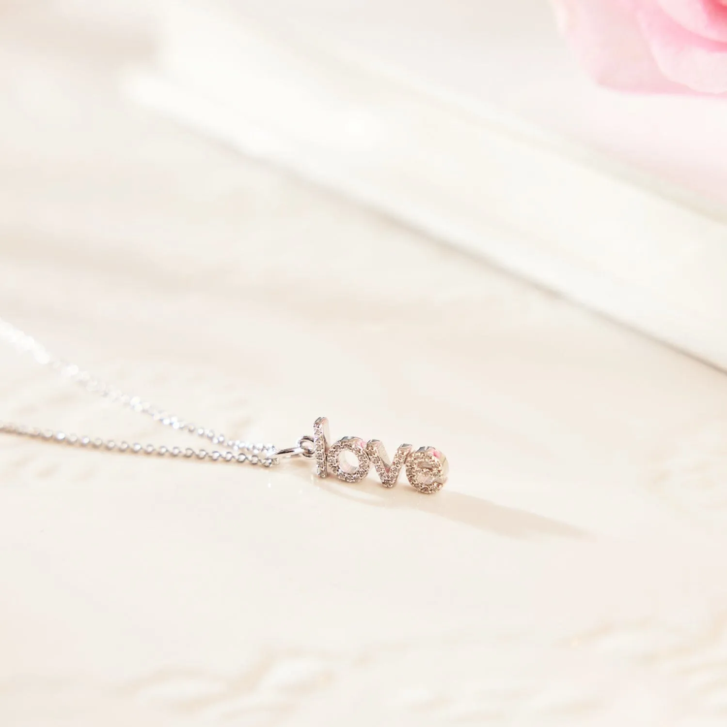 14k Gold Pavé Diamond Vertical Love Charm sold by Tiny Tags product image thumbnail 4