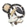 LUCKY Carved Onyx Feather Pendant in Solid Gold sold by Jane Win