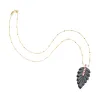 LUCKY Carved Onyx Feather Pendant in Solid Gold sold by Jane Win