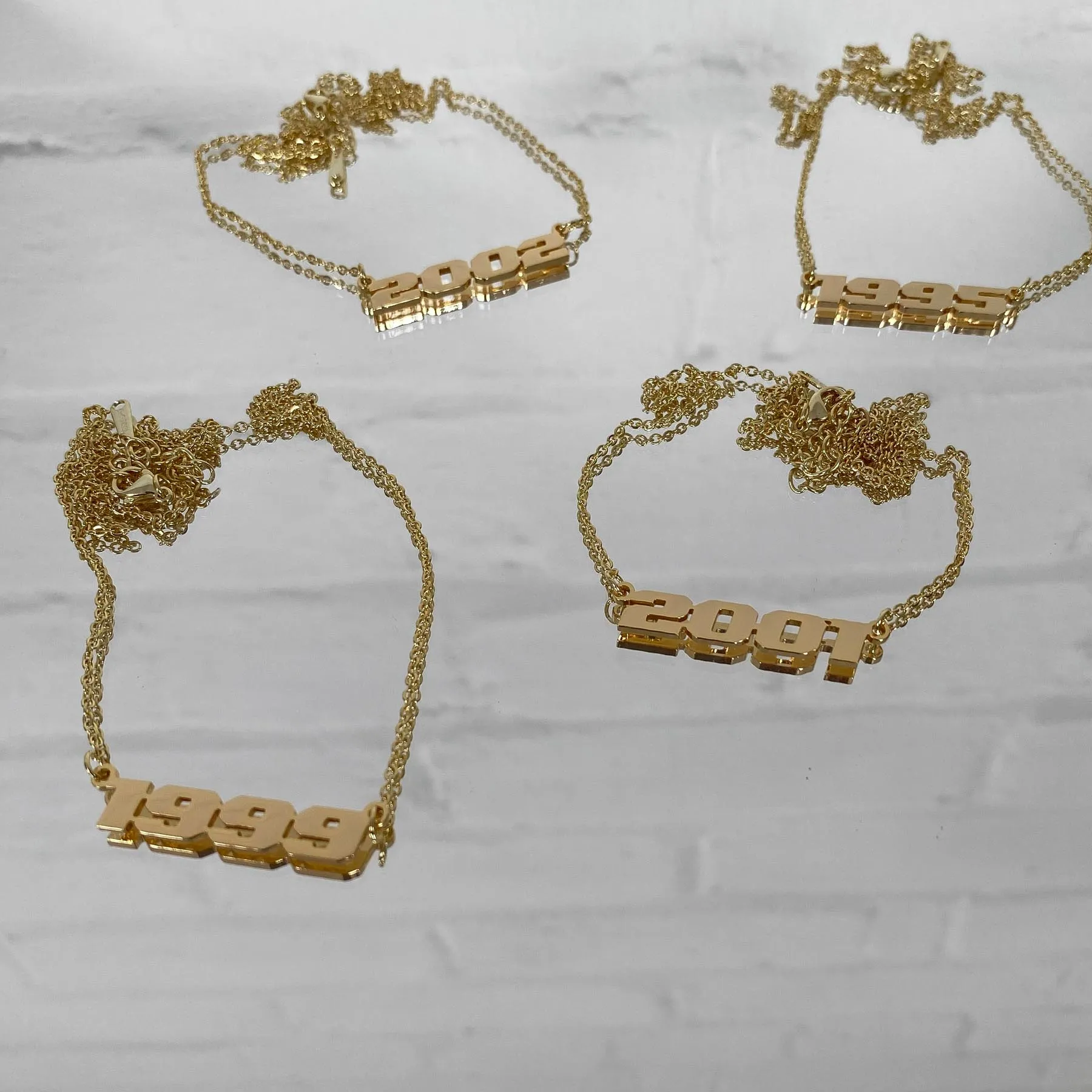 Birth Year Action Necklace sold by PRYA product image thumbnail 4