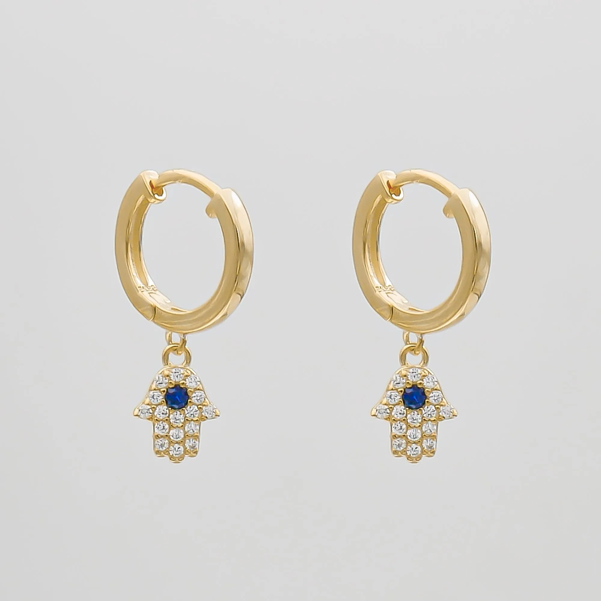 Hand of Hamsa Huggie Earrings sold by PRYA