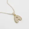 ICY Bubble Letter Initial Necklace sold by PRYA