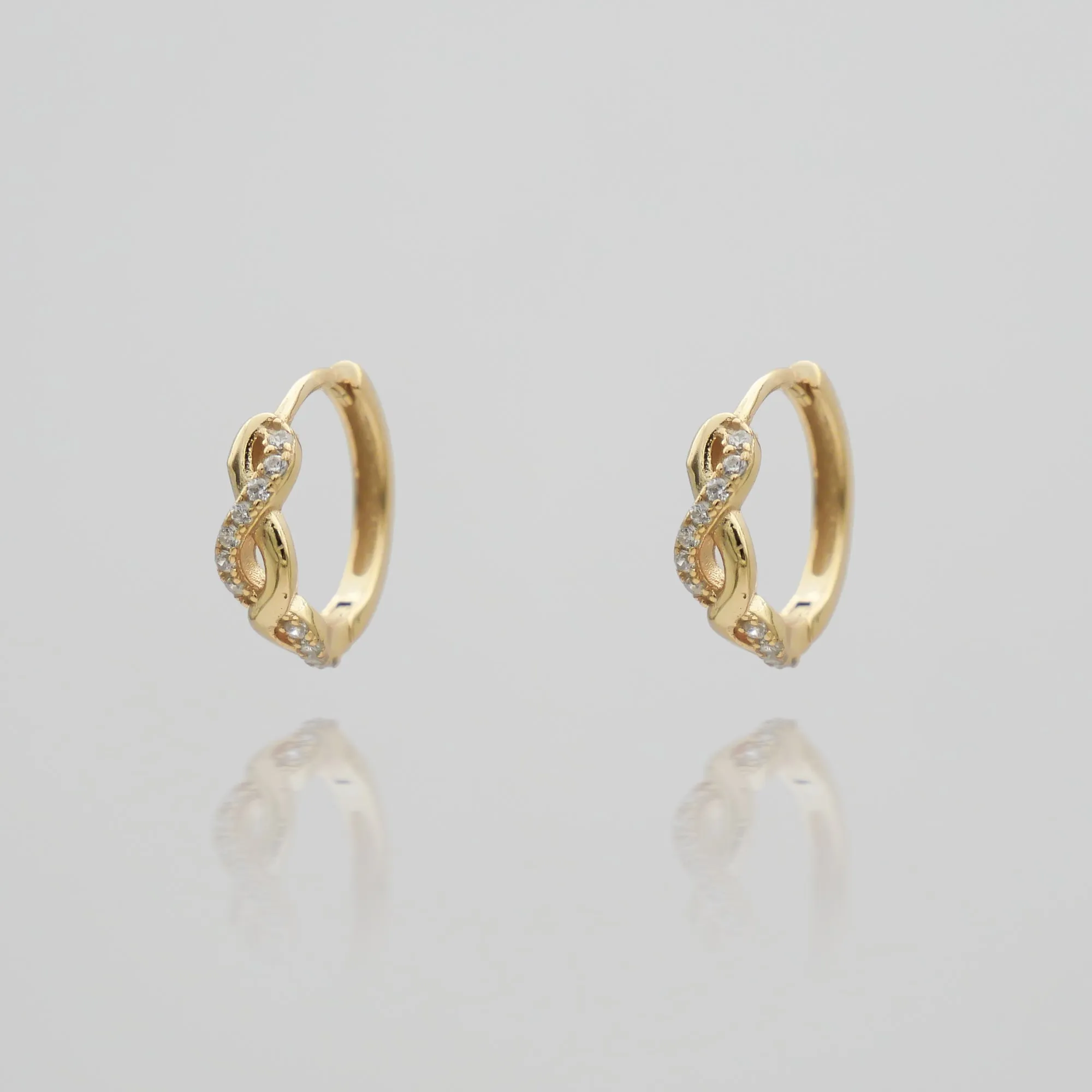 Riva Huggie Earrings sold by PRYA