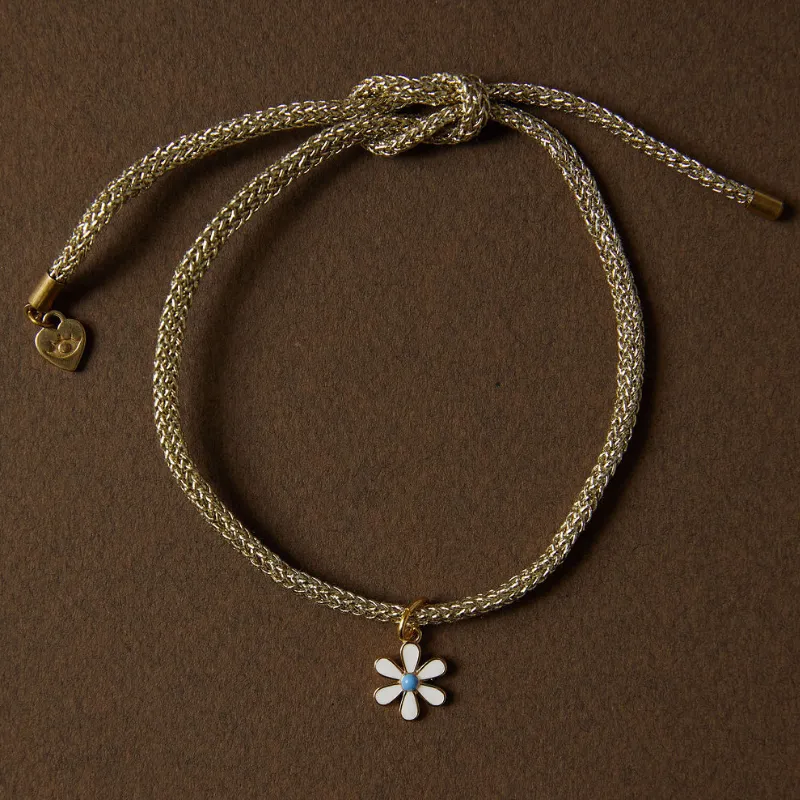 Gold Lurex Bracelet Cord with Mini White Enamel Flower Charm sold by HART product image thumbnail 3