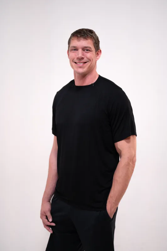 The Cameron Unisex Nursing and Skin to Skin Shirt in Black sold by Lila Maternity