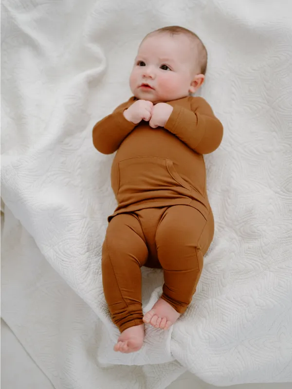 Finley Romper in Burnt Orange sold by Lila Maternity