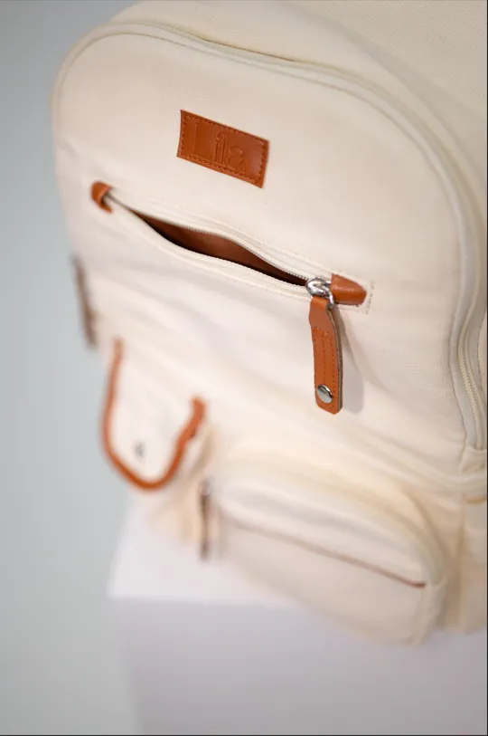 Lila Pumping & Nursing Diaper Bag in Cream sold by Lila Maternity