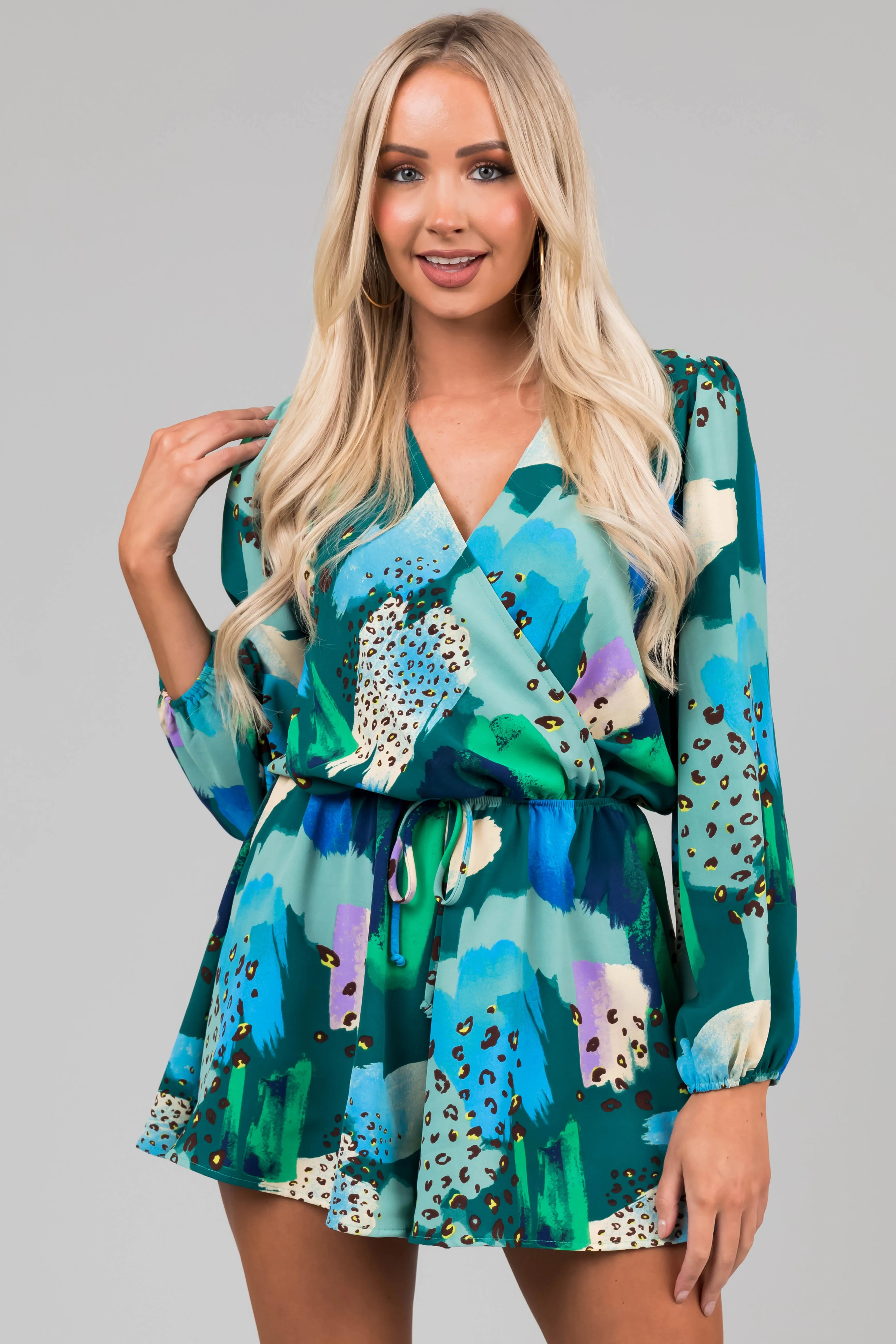 Teal Multicolor Abstract Surplice Flare Romper sold by Lime Lush