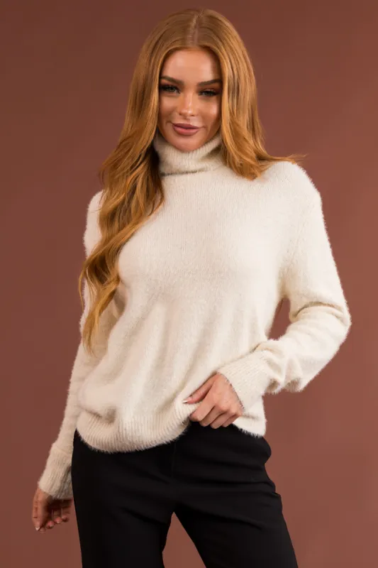 Cream Fuzzy Long Sleeve Turtleneck Sweater sold by Lime Lush