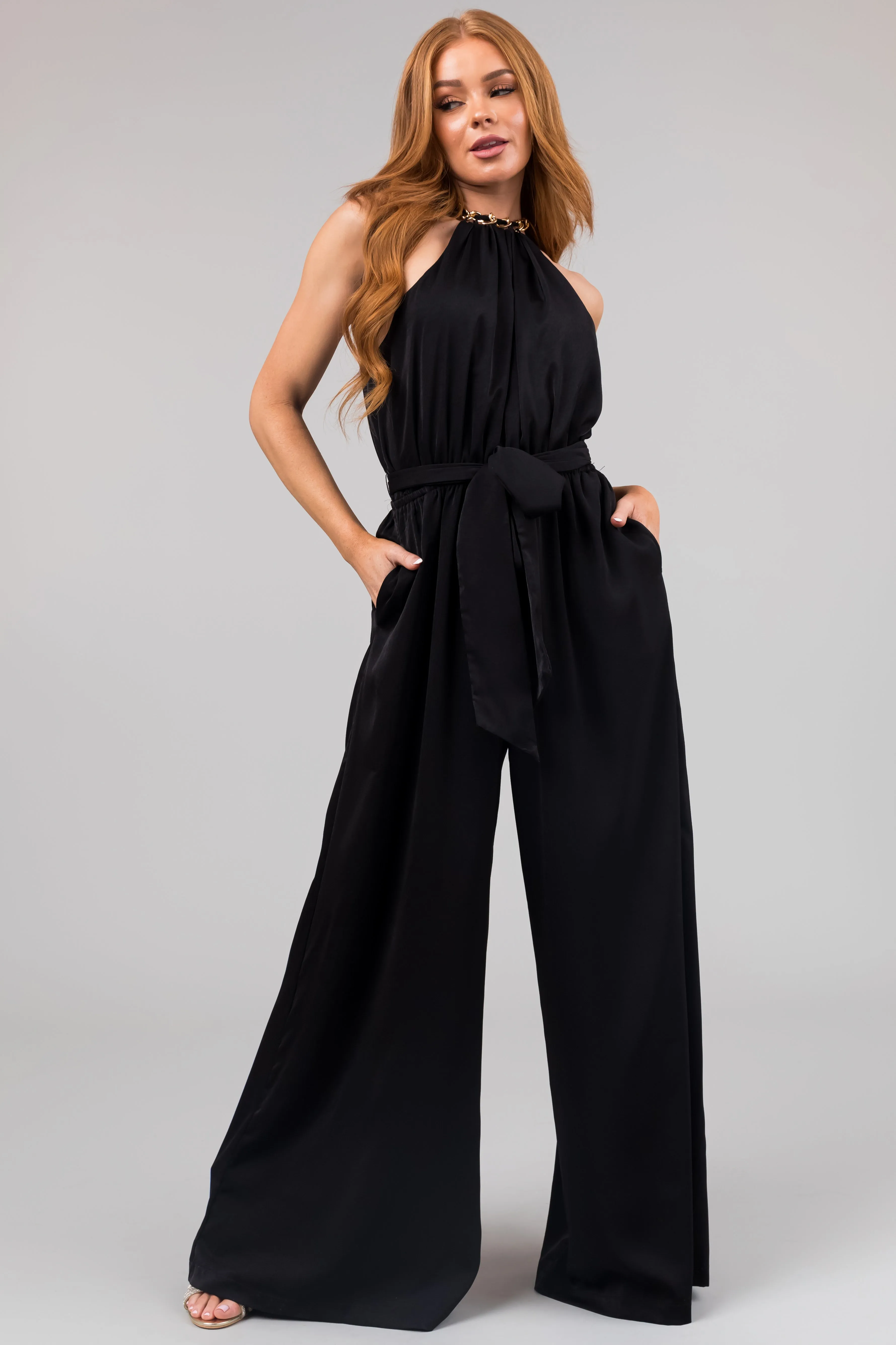 Black Sleeveless Chain Neckline Jumpsuit sold by Lime Lush