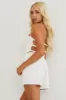 Off White Smocked Halter Neck Open Back Linen Romper sold by Lime Lush