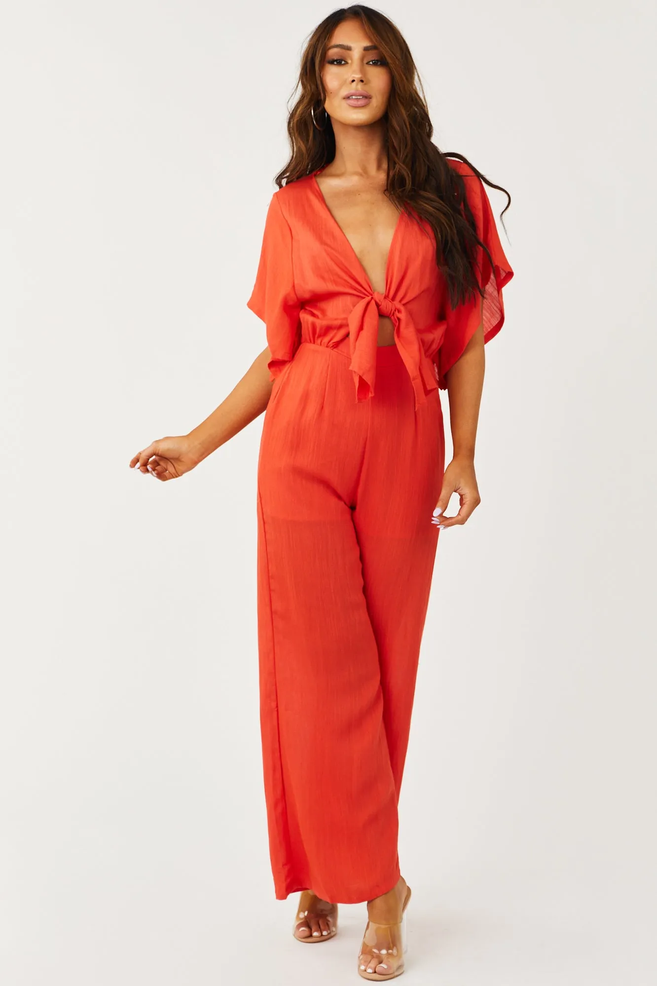 Bright Fire Plunging V Neck Wide Leg Jumpsuit sold by Lime Lush