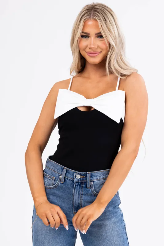 Black Spaghetti Strap Bodysuit with White Bow sold by Lime Lush