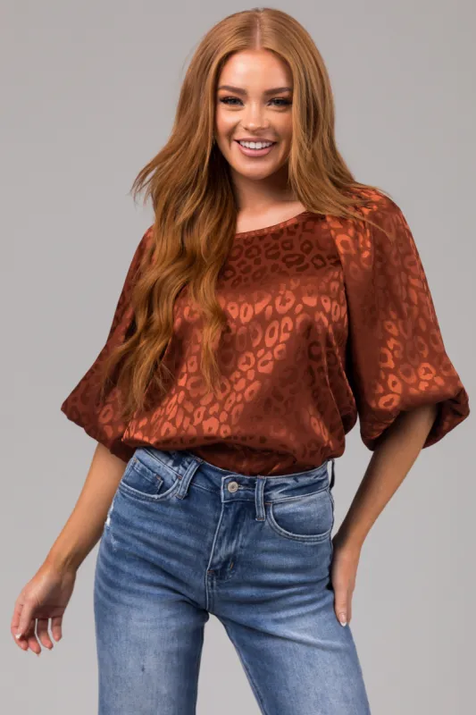 Cinnamon Animal Print Puff Sleeve Satin Top sold by Lime Lush