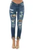KanCan Midwash Skinny Jeans with Leopard Cuffed Hem and Patches sold by Lime Lush