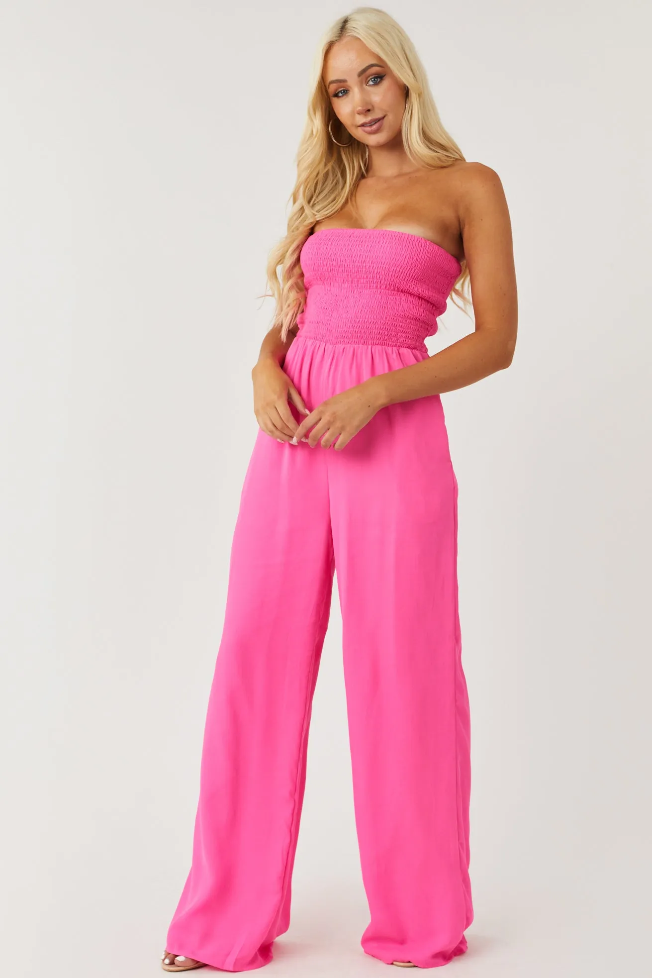 Vibrant Magenta Smocked Strapless Woven Jumpsuit sold by Lime Lush