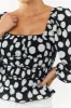 Black Polka Dot Smocked Puff Sleeve Bodysuit sold by Lime Lush