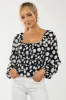 Black Polka Dot Smocked Puff Sleeve Bodysuit sold by Lime Lush