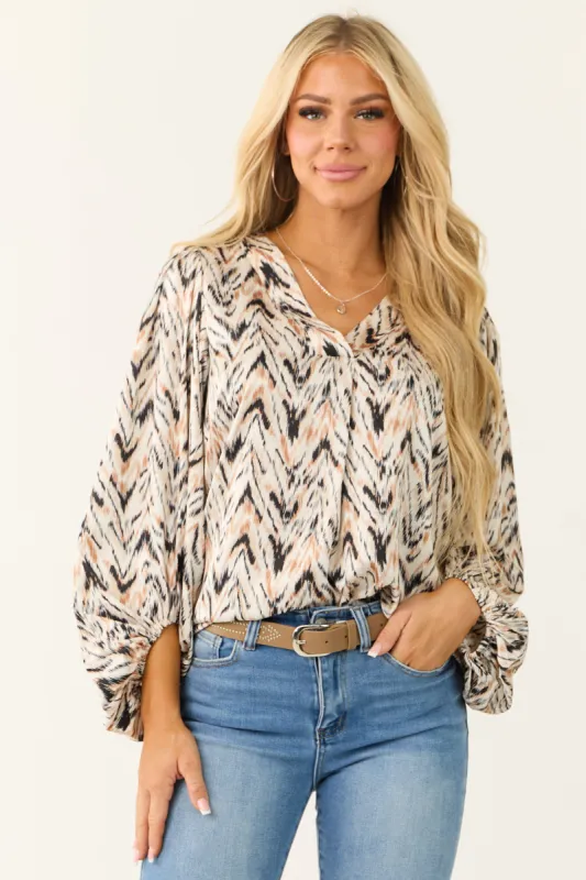 Ivory Abstract Print Long Sleeve V Neck Blouse sold by Lime Lush