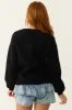 Black Jack-O-Lantern Graphic Soft Knit Sweater sold by Lime Lush